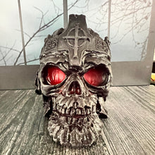 Load image into Gallery viewer, Make a bold statement with this Skull Beeswax Candle with Cross Crown, handcrafted from 100% pure American beeswax. This hauntingly detailed candle is the perfect addition to Halloween décor, gothic home décor, dark academia, witchy décor, haunted house displays, or spooky fall decorating.
