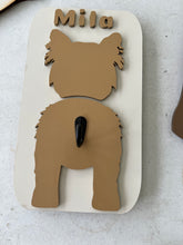 Load image into Gallery viewer, Keep your dog’s essentials organized while adding a personalized touch to your home with this custom dog leash holder. Featuring your dog’s breed silhouette and personalized name, each leash holder is precision laser cut from premium maple plywood and individually hand-painted, making every piece a unique keepsake for your favorite four-legged friend.