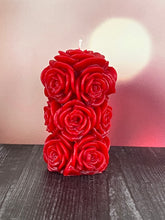Load image into Gallery viewer, Bring timeless elegance and the warm glow of natural beeswax into your home with this handcrafted Rose Beeswax Pillar Candle. Beautifully sculpted with delicate rose petals, this stunning floral candle creates a cozy ambiance while showcasing the natural beauty of pure American beeswax.