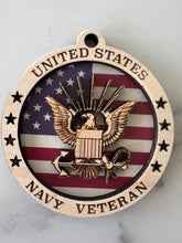 Load image into Gallery viewer, Celebrate the heros that fought for our freedom with these Military Medallions.  These 4” round ornaments display a flag background and your choice of military insignias on the front.  The perfect way to thank the veterans or active duty hero’s in your life.