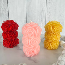 Load image into Gallery viewer, Bring timeless elegance and the warm glow of natural beeswax into your home with this handcrafted Rose Beeswax Pillar Candle. Beautifully sculpted with delicate rose petals, this stunning floral candle creates a cozy ambiance while showcasing the natural beauty of pure American beeswax.