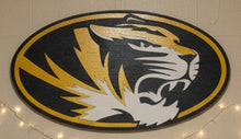 Load image into Gallery viewer, An oval wooden sign featuring a stylized tiger head logo in yellow, black, and white