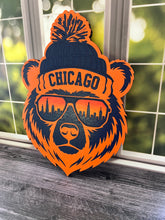 Load image into Gallery viewer, Show off your love for Chicago and hometown spirit with this bold bear sign! Featuring a cool bear dressed for chilly Chicago weather in a stocking cap and sunglasses, this layered design brings together classic orange and navy colors with unmistakable Windy City style.