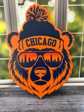 Load image into Gallery viewer, Show off your love for Chicago and hometown spirit with this bold bear sign! Featuring a cool bear dressed for chilly Chicago weather in a stocking cap and sunglasses, this layered design brings together classic orange and navy colors with unmistakable Windy City style.