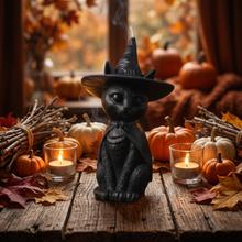Load image into Gallery viewer, Celebrate the magic of Halloween with this enchanting Black Cat Beeswax Candle, handcrafted from 100% pure American beeswax. Featuring a charming black cat wearing a classic witch's hat adorned with a mystical triple moon symbol and skull centerpiece, this candle is the perfect accent for Halloween displays, gothic home décor, altars, and witchy spaces.