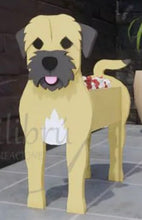 Load image into Gallery viewer, Bring some furry love to your home with our charming Border Terrier Dog Planter. Not only does it welcome guests with it's adorable design, but you can also add a custom dog tag with your pet's name for an extra personal touch (additional $5). The perfect gift for dog lovers, this planter is sure to bring a smile to anyone's face. Get yours now and show your love for man's best friend.