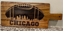 Load image into Gallery viewer, It's football season & time to party.  Step up your appetizers this your with this incredible Chicago Football Charcuterie Board featuring a football design with the Chicago skyline engraved in it.  