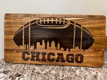 Load image into Gallery viewer, It's football season & time to party.  Step up your appetizers this your with this incredible Chicago Football Charcuterie Board featuring a football design with the Chicago skyline engraved in it.  