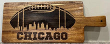 Load image into Gallery viewer, It's football season & time to party.  Step up your appetizers this your with this incredible Chicago Football Charcuterie Board featuring a football design with the Chicago skyline engraved in it.  