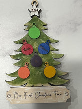 Load image into Gallery viewer, This beautiful Christmas Tree Personalized Ornament is sure to become a cherished, family favorite for years to come.  Add your loved ones and/or pets names to the ornaments on the tree to create a lasting keepsake.   Available in 3 different, hand painted styles and your choice of natural wood or colored ornaments.  Add a custom banner at the bottom to make it uniquely yours.  Please specify color of ornament and name when ordering.  