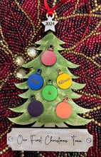Load image into Gallery viewer, This beautiful Christmas Tree Personalized Ornament is sure to become a cherished, family favorite for years to come.  Add your loved ones and/or pets names to the ornaments on the tree to create a lasting keepsake.   Available in 3 different, hand painted styles and your choice of natural wood or colored ornaments.  Add a custom banner at the bottom to make it uniquely yours.  Please specify color of ornament and name when ordering.  