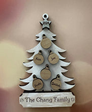 Load image into Gallery viewer, This beautiful Christmas Tree Personalized Ornament is sure to become a cherished, family favorite for years to come.  Add your loved ones and/or pets names to the ornaments on the tree to create a lasting keepsake.   Available in 3 different, hand painted styles and your choice of natural wood or colored ornaments.  Add a custom banner at the bottom to make it uniquely yours.  Please specify color of ornament and name when ordering.  
