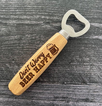 Load image into Gallery viewer, Pop open your favorite beverage in style with our engraved wood-handled bottle openers! Crafted with a durable stainless steel opener and a smooth wooden handle, these openers offer a comfortable grip and a sleek, rustic look.