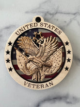 Load image into Gallery viewer, Celebrate the heros that fought for our freedom with these Military Medallions.  These 4” round ornaments display a flag background and your choice of military insignias on the front.  The perfect way to thank the veterans or active duty hero’s in your life.