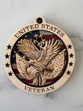 Load image into Gallery viewer, Celebrate the heros that fought for our freedom with these Military Medallions.  These 4” round ornaments display a flag background and your choice of military insignias on the front.  The perfect way to thank the veterans or active duty hero’s in your life.