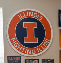 Load image into Gallery viewer, A circular Illinois Fighting Illini sign featuring an orange and navy blue design