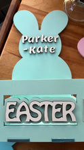 Load image into Gallery viewer, Make this Easter unforgettable with our Adorable Wood Crate Easter Basket, personalized with your child's name on top. Elevate the joy of the egg hunt and create lasting memories with these charming, customized Easter baskets designed just for your little ones.