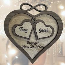 Load image into Gallery viewer, This beautiful Love Ornament can be customized with the couple's names and wedding or engagement date to create a lasting keepsake that will be treasured for years to come.  