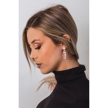 Load image into Gallery viewer, Score big on game day with our stylish Football Earrings! Designed with a realistic football-textured finish, these earrings are the perfect way to showcase your love for the game and your team spirit. Lightweight and easy to wear, they feature a sleek 1.5" football-shaped design that adds the perfect sporty touch to any outfit.