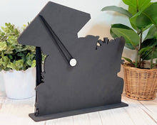 Load image into Gallery viewer, This Graduation Tassel Holder is the perfect way to commemorate your special event. It is designed to securely hold your tassel in place and is personalized with your name, graduation year or a personalized message. Show off your style and pride with a custom made holder that you can use to display your graduation tassel.  Available in 2023, 2024, 2025 and 2026 styles.    Back view.