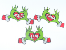 Load image into Gallery viewer, Embrace the humor and charm of the holiday season with our delightful Grouch Hands & Heart Personalized Ornaments – the ultimate gift for the Grouch in your life. Measuring approximately 5" wide x 2.5" long, these ornaments pack a punch of personality and are sure to bring a smile to anyone with a touch of the grumpies.