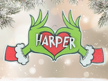 Load image into Gallery viewer, Embrace the humor and charm of the holiday season with our delightful Grouch Hands & Heart Personalized Ornaments – the ultimate gift for the Grouch in your life. Measuring approximately 5" wide x 2.5" long, these ornaments pack a punch of personality and are sure to bring a smile to anyone with a touch of the grumpies.