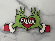 Load image into Gallery viewer, Embrace the humor and charm of the holiday season with our delightful Grouch Hands & Heart Personalized Ornaments – the ultimate gift for the Grouch in your life. Measuring approximately 5" wide x 2.5" long, these ornaments pack a punch of personality and are sure to bring a smile to anyone with a touch of the grumpies.