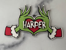 Load image into Gallery viewer, Embrace the humor and charm of the holiday season with our delightful Grouch Hands & Heart Personalized Ornaments – the ultimate gift for the Grouch in your life. Measuring approximately 5" wide x 2.5" long, these ornaments pack a punch of personality and are sure to bring a smile to anyone with a touch of the grumpies.