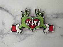 Load image into Gallery viewer, Embrace the humor and charm of the holiday season with our delightful Grouch Hands & Heart Personalized Ornaments – the ultimate gift for the Grouch in your life. Measuring approximately 5" wide x 2.5" long, these ornaments pack a punch of personality and are sure to bring a smile to anyone with a touch of the grumpies.