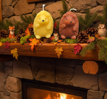Load image into Gallery viewer, Bring the charm of the forest into your home with this adorable Hedgehog Beeswax Candle! Available in two delightful poses—standing upright or with all four paws on the ground—these highly detailed woodland candles are the perfect addition to any nature-inspired décor.