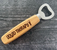 Load image into Gallery viewer, Pop open your favorite beverage in style with our engraved wood-handled bottle openers! Crafted with a durable stainless steel opener and a smooth wooden handle, these openers offer a comfortable grip and a sleek, rustic look.