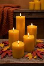 Load image into Gallery viewer, Classic 3" round beeswax pillar candles, available in 5 sizes (select size and quantity from drop down menus when ordering). These bright glowing pillars will fill the air with a natural hint of warm, fresh honey, purifying your air all the while. A favorite for housewarming gifts, these handmade candles are perfect for your needs and have a very long burn time! 