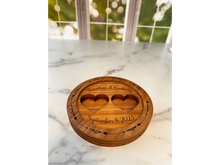Load image into Gallery viewer, Elevate the presentation of your wedding rings with our exquisite Personalized Ring Bearer Box – the perfect alternative to the traditional ring bearer pillow. This 6" round box is designed to add an extra touch of elegance to your wedding ceremony