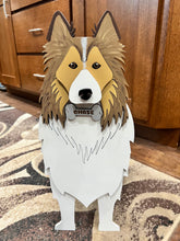 Load image into Gallery viewer, Welcome friends and family with this beautiful handcrafted Sheltie (Shetland Sheepdog) Planter Box! This charming decorative piece is the perfect addition to your front porch, entryway, covered patio, or home décor. It's a wonderful gift for Sheltie owners, dog lovers, birthdays, housewarmings, or any special occasion.
