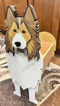 Load image into Gallery viewer, Welcome friends and family with this beautiful handcrafted Sheltie (Shetland Sheepdog) Planter Box! This charming decorative piece is the perfect addition to your front porch, entryway, covered patio, or home décor. It's a wonderful gift for Sheltie owners, dog lovers, birthdays, housewarmings, or any special occasion.