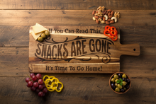 Load image into Gallery viewer, Add some laughter to your next party with this If you can read this the SNACKS ARE GONE and it's time to go home Charcuterie Board.
This exquisite Acacia Wood Cutting Board, a versatile and stylish addition to your kitchen or entertaining space. Crafted from high-quality acacia wood, this cutting board not only provides a durable surface for all your slicing and dicing needs but also doubles as a charming charcuterie board for serving appetizers with flair.