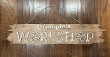 Load image into Gallery viewer, welcome one and all to your creative haven and personalize this sign with your favorite craftsman's name prominently displayed at the top. Crafted with care, this sign is more than just an entrance statement; it's a celebration of your passion for creating.  The workshop letters are uniquely formed from an array of tools, adding a whimsical touch that speaks directly to the heart of every craftsman.