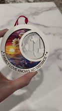 Load and play video in Gallery viewer, This beautiful ornament is sure to be the highlight of your long distance, loved ones Christmas, holiday or seasonal celebration.  Add up to 4 states (other countries are available upon request).  Features stained glass style acrylic on one side & up to 4 states on the opposite side.  Also makes a great Mother's Day or Father's Day gift.