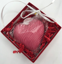 Load image into Gallery viewer, That special someone is sure to feel the love this Valentines Day when they open this fantastic Valentines Day Gift Box Trio.  A stack of 3 red boxes tied with a white ribbon.  Set contains 1 Red Beeswax Rose Pillar Candle, 1 Lavender Bath Bomb & 1 Heart Shaped Goat's Milk Soap in either Lavender or Rose Geranium scents.