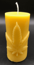 Load image into Gallery viewer, Leaf design beeswax candle. Leaf design on front of this candle shown with green sparkle mica leaf.