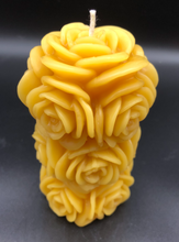 Load image into Gallery viewer, 4 1/4" Rose Beeswax Candle. This beeswax candle is decorated with roses carved into the sides and top of the candle.