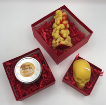 Load image into Gallery viewer, For that special goth or skull lover in your life, treat them to this gothic, creepy Valentines Day Gift Box Trio.  Set includes 1 Bleeding Skull and Bones Candle, 1 votive sized Skull Beeswax Candle and one Honey Lotion Bar all packaged up in a set of red stacked boxes and tied with a ribbon.