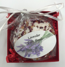 Load image into Gallery viewer, That special someone is sure to feel the love this Valentines Day when they open this fantastic Valentines Day Gift Box Trio.  A stack of 3 red boxes tied with a white ribbon.  Set contains 1 Red Beeswax Rose Pillar Candle, 1 Lavender Bath Bomb & 1 Heart Shaped Goat's Milk Soap in either Lavender or Rose Geranium scents.