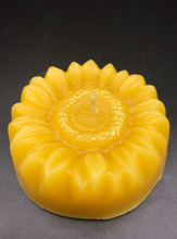Load image into Gallery viewer, Adorable Sunflower shaped beeswax candle. This bright and cheery beeswax candle is sure to brighten everyone's day. A slight shimmer of gold mica in the center adds a touch of whimsey to this summer favorite.