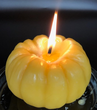 Load image into Gallery viewer, Settle into fall with this pumpkin beeswax candle! Made with pure beeswax, this decorative candle makes for perfect fall decor, front porch decor, a housewarming gift, Halloween decor, Thanksgiving decor or even a nice choice for some fall wedding decor! Homemade candles are sure to add some charm and create a warm atmosphere in your space. When burned, this candle leaves a wonderful and natural hint of a sweet honey aroma -- completely natural! No fragrance added. Just as nature intended :)