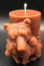 Load image into Gallery viewer, Mama and baby bear beeswax candle. All natural, sourced from an American, family owned apiary. Handmade in the USA. This Mama and Baby Bear beeswax candle looks absolutely stunning in any room when lit, as the soft glow lights up the cuddling duo. The scene wraps around the entire candle with images of bears in the wilderness. A wonderful compliment to any cabin or rustic design or as a gift to the outdoorsy types in your life.  Brown shown.