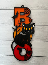 Load image into Gallery viewer, Light up your Halloween decor with this incredible Cat Boo sign.  The perfect addition to your spooky Halloween decor! This adorable black cat design is sure to charm your guest and add a playful touch to your home.  Featuring a whimsical black cat with bats and spider webs, this decorative piece sits atop the word &quot;BOO&quot; in bright orange, yellow and red, making it a vibrant and eye-catching accent for any space.  
