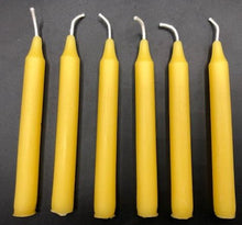Load image into Gallery viewer, Set of 12 Chime Beeswax Candles.  These are the perfect candle to bring attention and intention to the moment.  Packaged in bags of 12.  Kept out of drafts and away from fans, these mini tapers will burn virtually dripless for roughly two hours.  Perfect for meditation, prayer candles, ritual candles or alter candles.  Available in Natural (gold) beeswax, cream, purple, pink, red, blue, green, orange, brown or black.