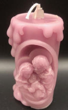Load image into Gallery viewer, These beautifully detailed Religious Candles depict four different bible scenes - Jesus on the cross, the Virgin Mary, the Holy Family & the Nativity manger scene.  Bring the spirit of Christ into your home with these gorgeous beeswax candles.  They make fantastic gifts, are great for Christmas decor, housewarming gifts, holiday centerpieces and alters.  Available in purple, blue or natural yellow beeswax.  **** Please note desired color when ordering.
