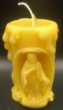 Load image into Gallery viewer, These beautifully detailed Religious Candles depict four different bible scenes - Jesus on the cross, the Virgin Mary, the Holy Family &amp; the Nativity manger scene.  Bring the spirit of Christ into your home with these gorgeous beeswax candles.  They make fantastic gifts, are great for Christmas decor, housewarming gifts, holiday centerpieces and alters.  Available in purple, blue or natural yellow beeswax.  **** Please note desired color when ordering.
